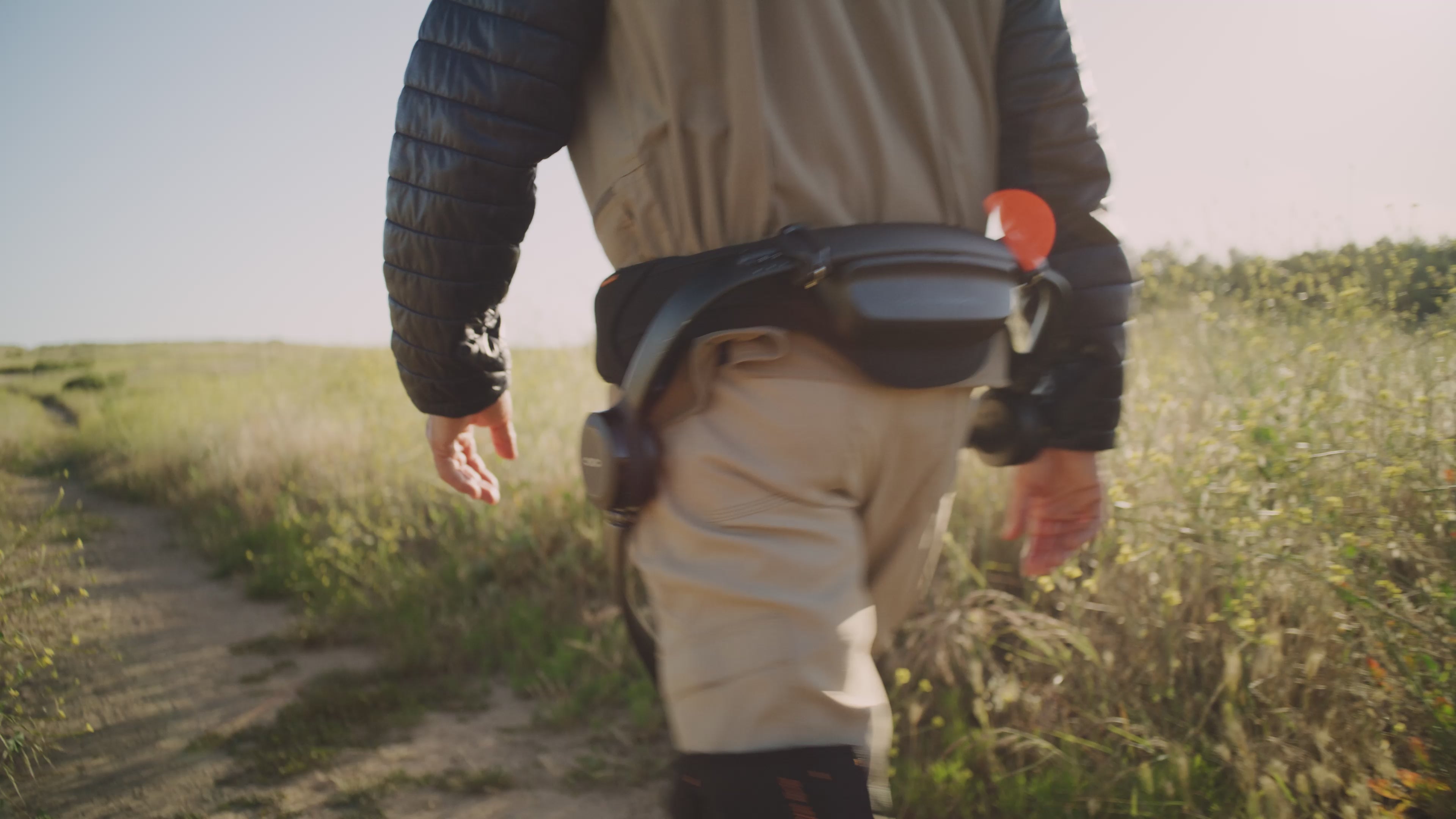 A man wearing Hypershell walking