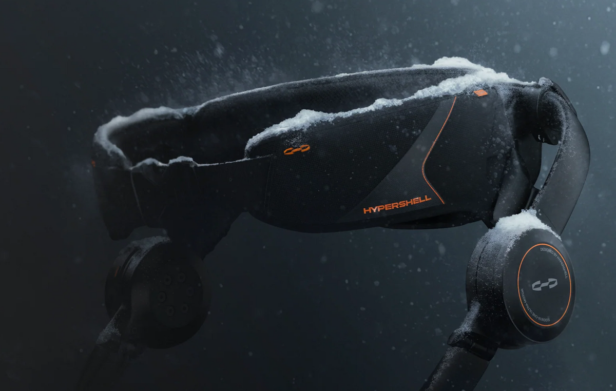 Manufacturer close-up of a Hypershell hip belt and motor with snow on the exterior