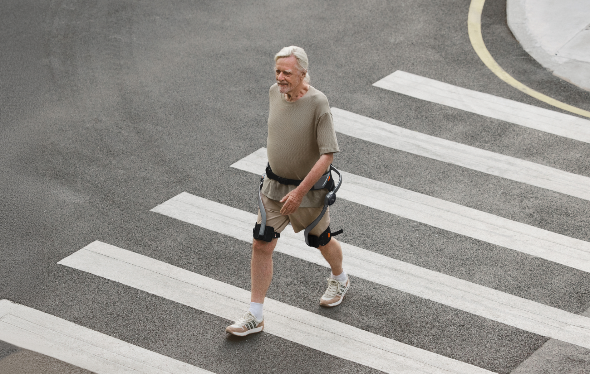 Person wearing a Hypershell X Series S exoskeleton while crossing a city street